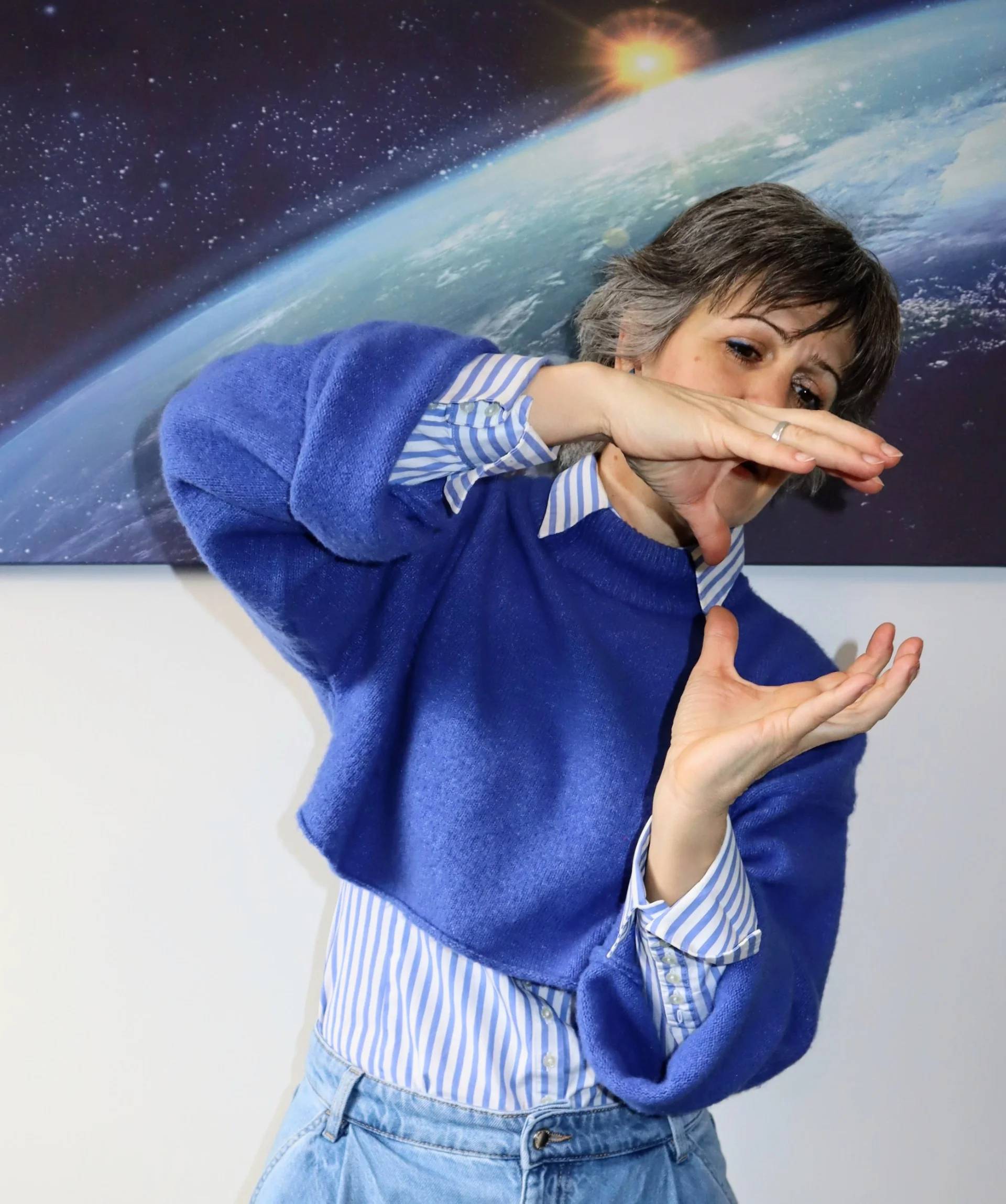 Person framing a view with their hands