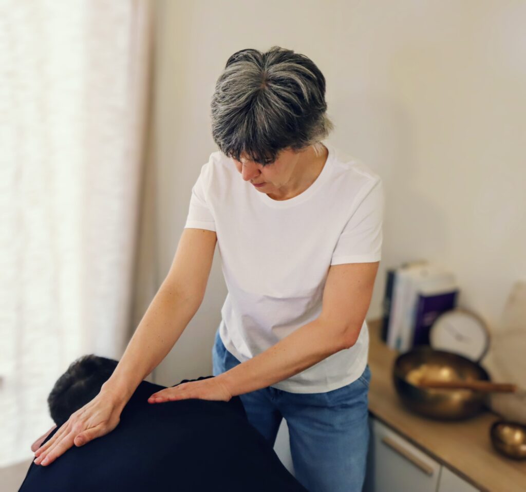 Person receiving a massage by a healer